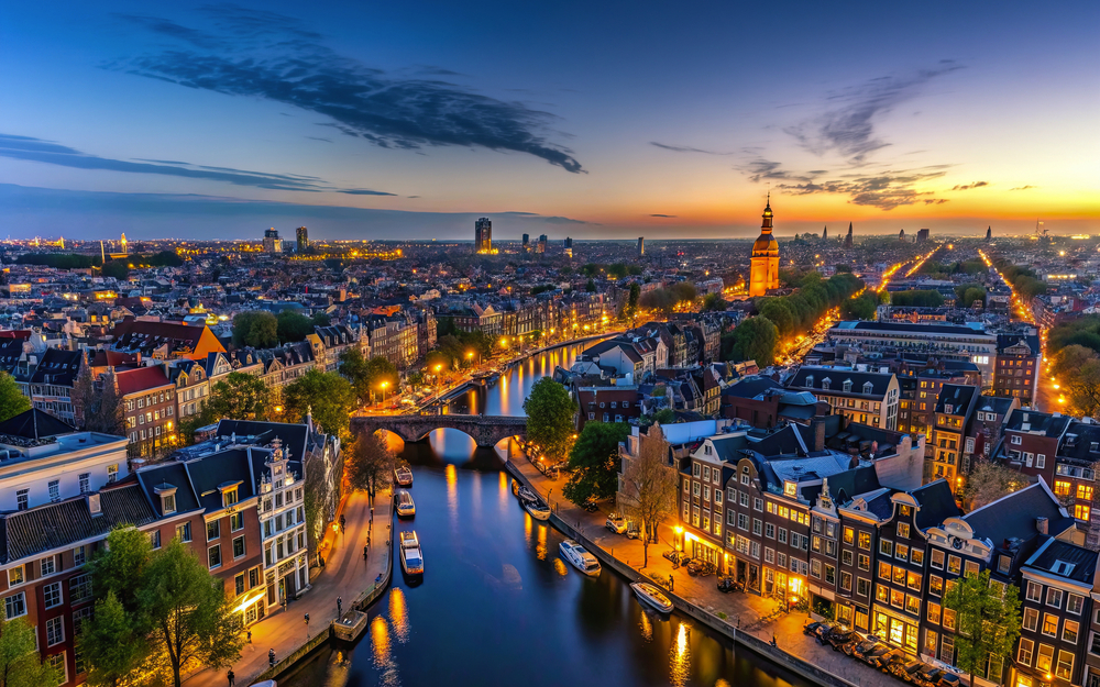 Aerial view of Amsterdam canals and old center district at night