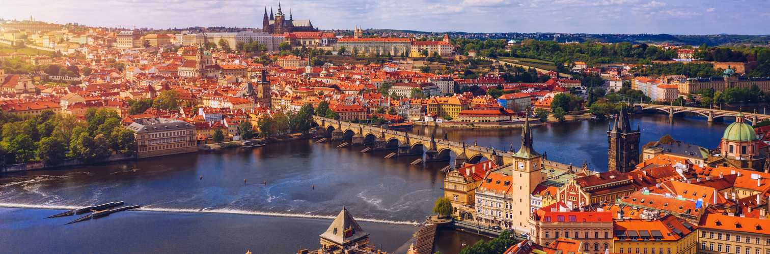 Prague scenic spring aerial view of the Prague Old Town pier architecture Charles Bridge over Vltava river in Prague, Czechia. Old Town of Prague with the Castle in the background, Czech Republic.